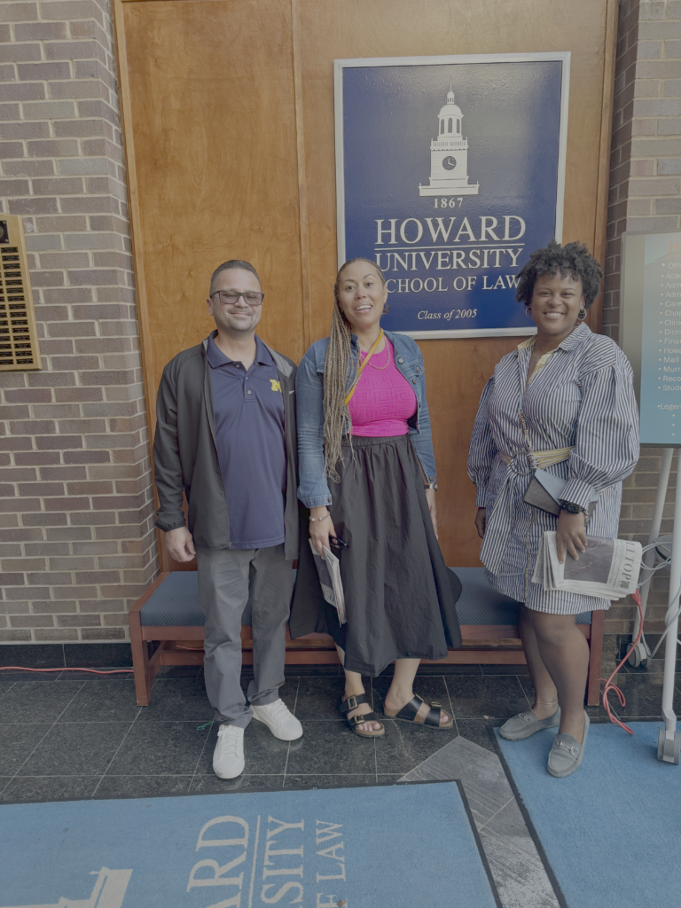 A photo of our CLAs Chris and Lauren with our former paralegal Jasmine Valentine at Howard University