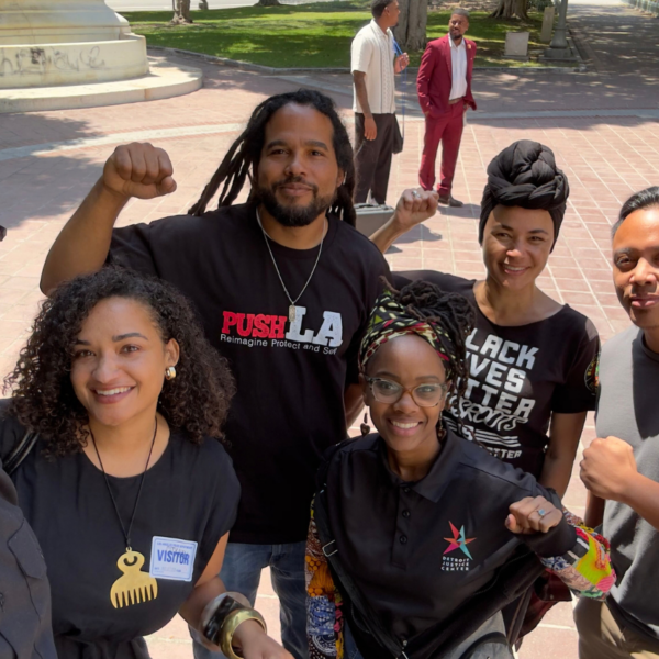 DJC's Liz Kennedy and Sheba Rogers with members of La Defensa
